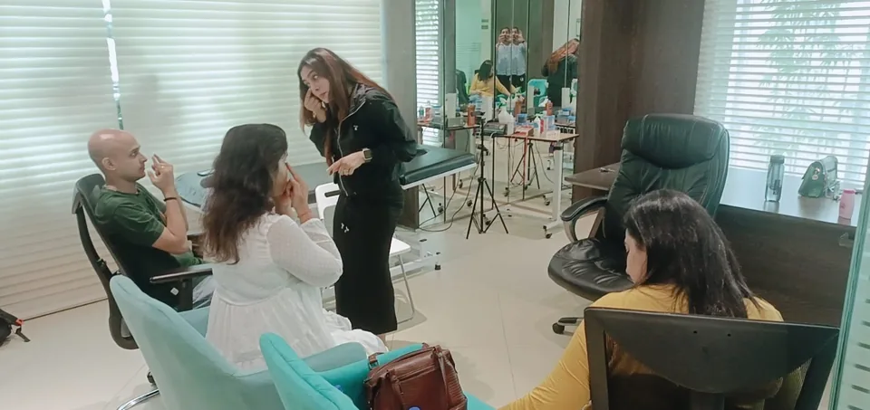 Vibha Jain seated with a group of participants during an interactive session, guiding a focused-attention exercise.